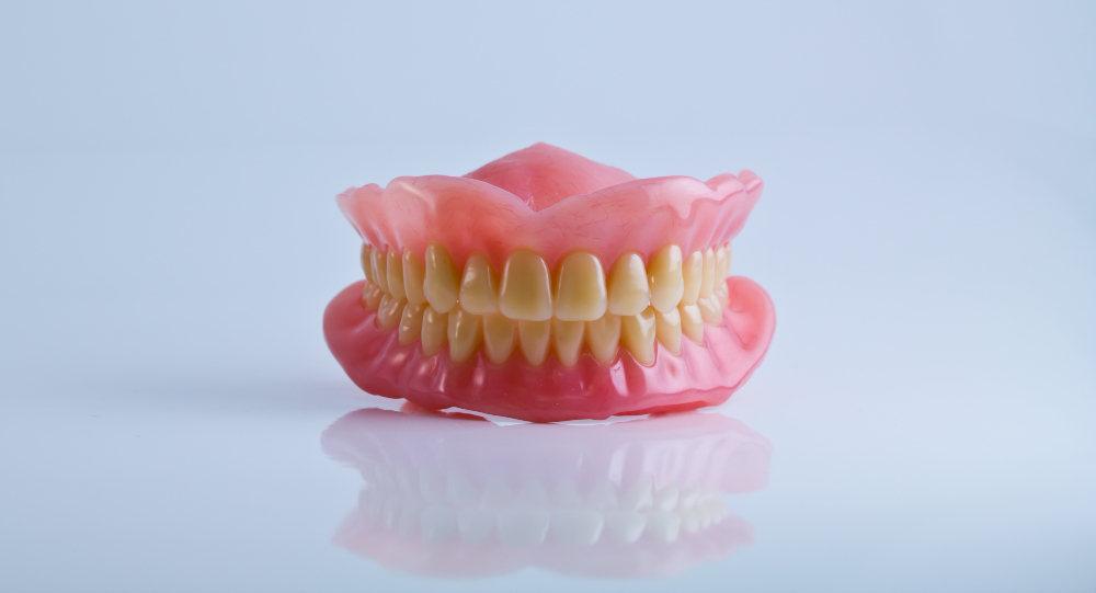 Image of a pair of dentures to show what dentures vs implants look like.