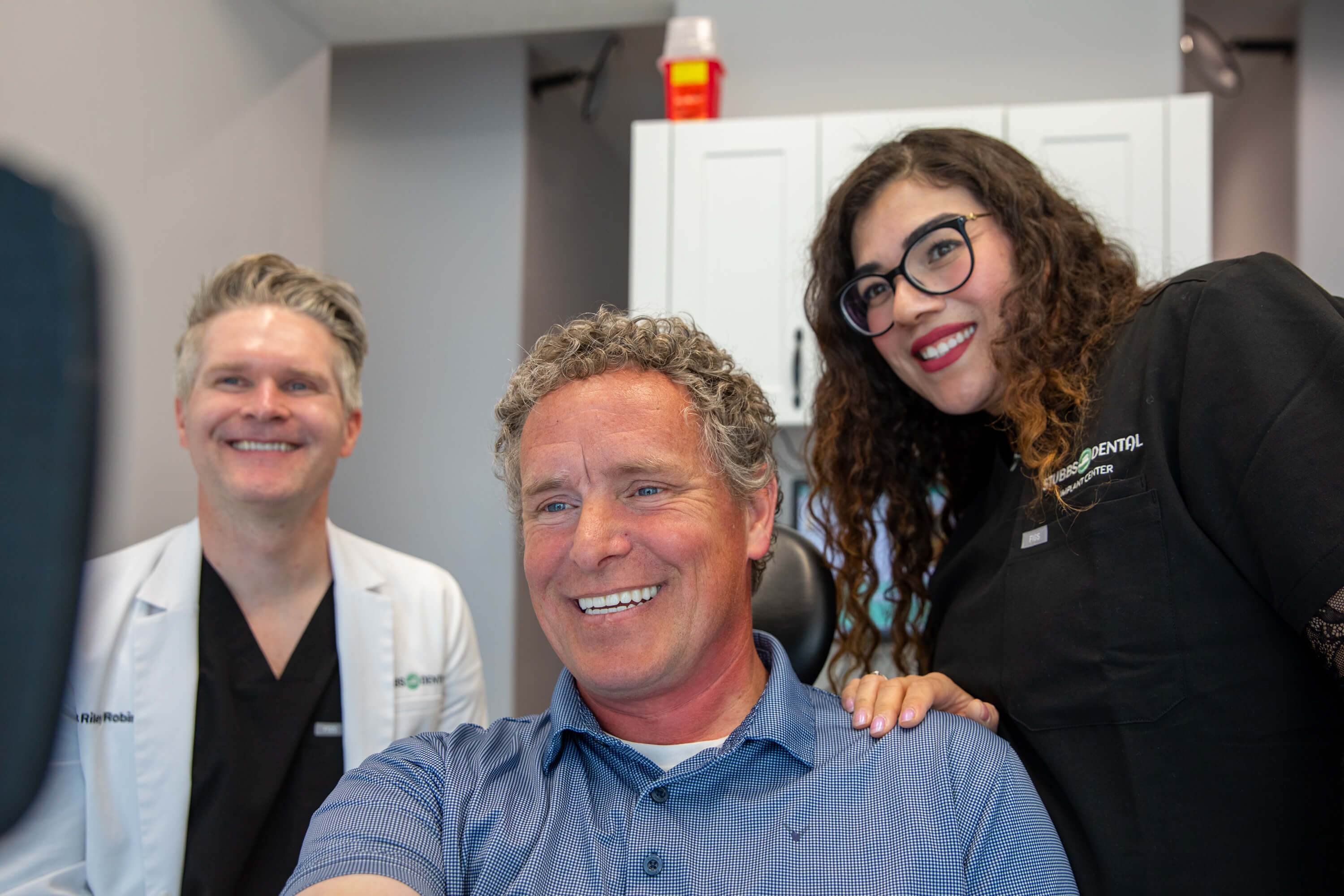 Stubbs Dental Implant Center patient and team smiling
