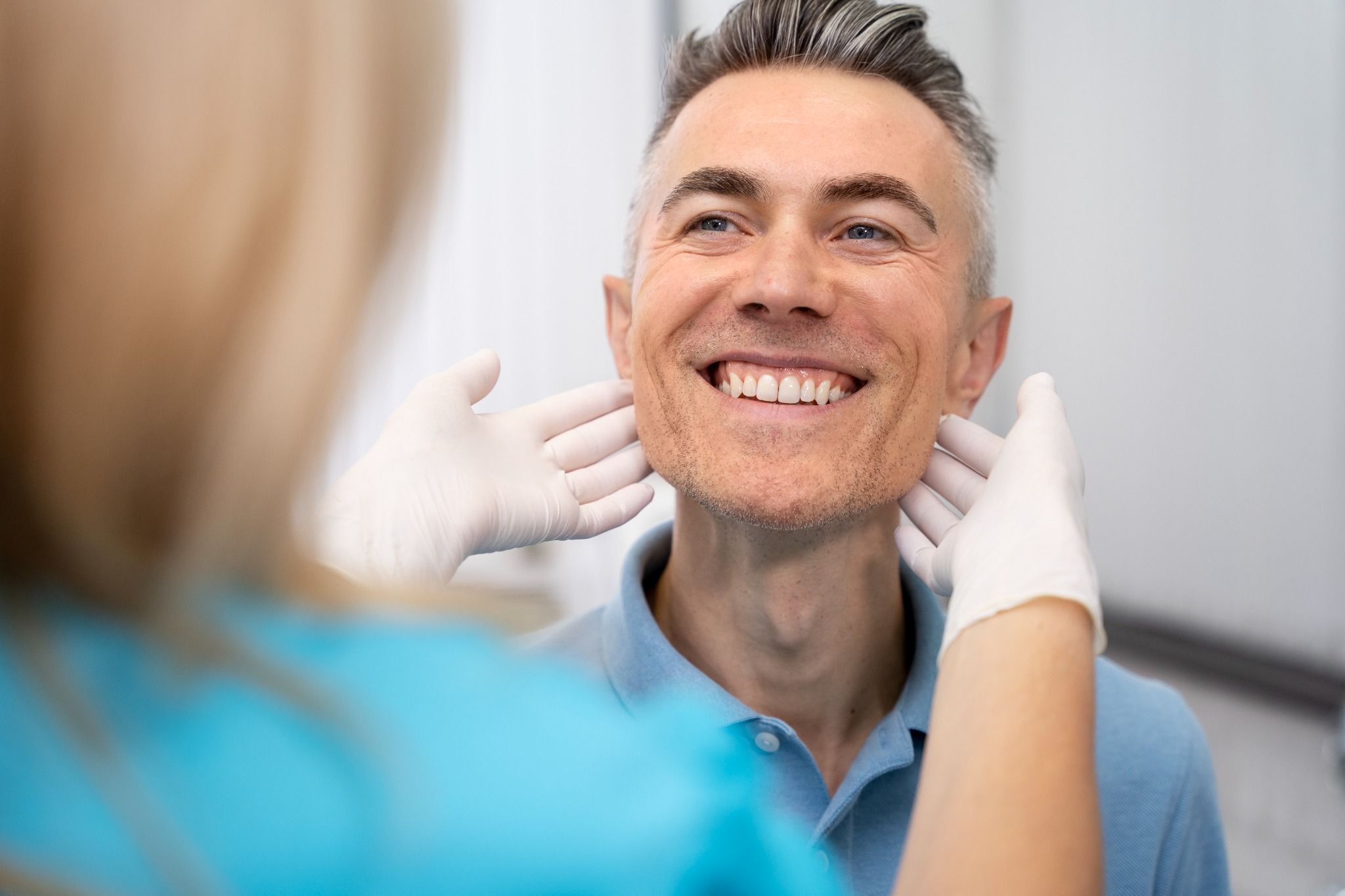 close-up-doctor-checking-man_compressed