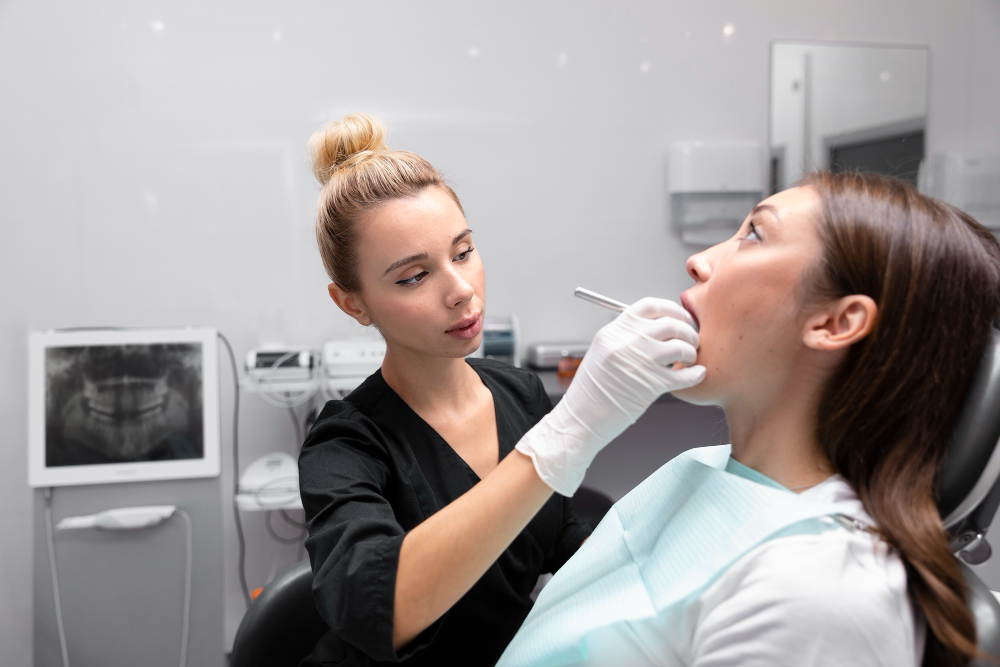 Young woman at wisdom teeth removal treatment consultation  with options at a dental office.